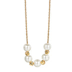 isolated brass necklace with seven white shell pearls