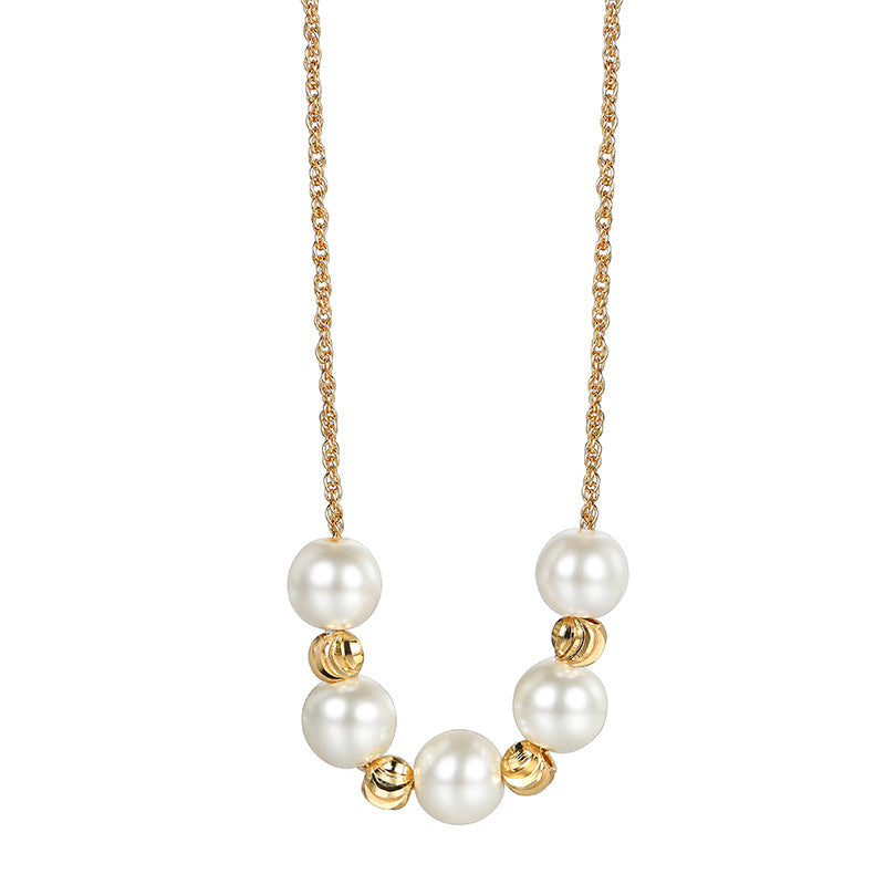 isolated brass necklace with seven white shell pearls