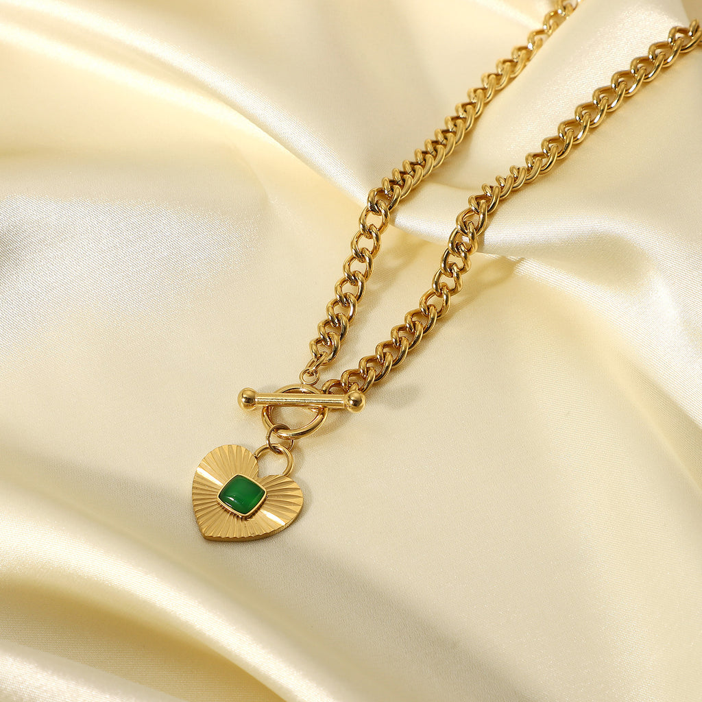 close view of the front toggle clasp and ridged heart pendant
