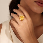gold-tone spiral shell ring worn on model