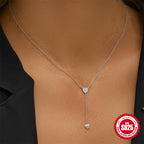 model wearing the silver-finish heart Y necklace