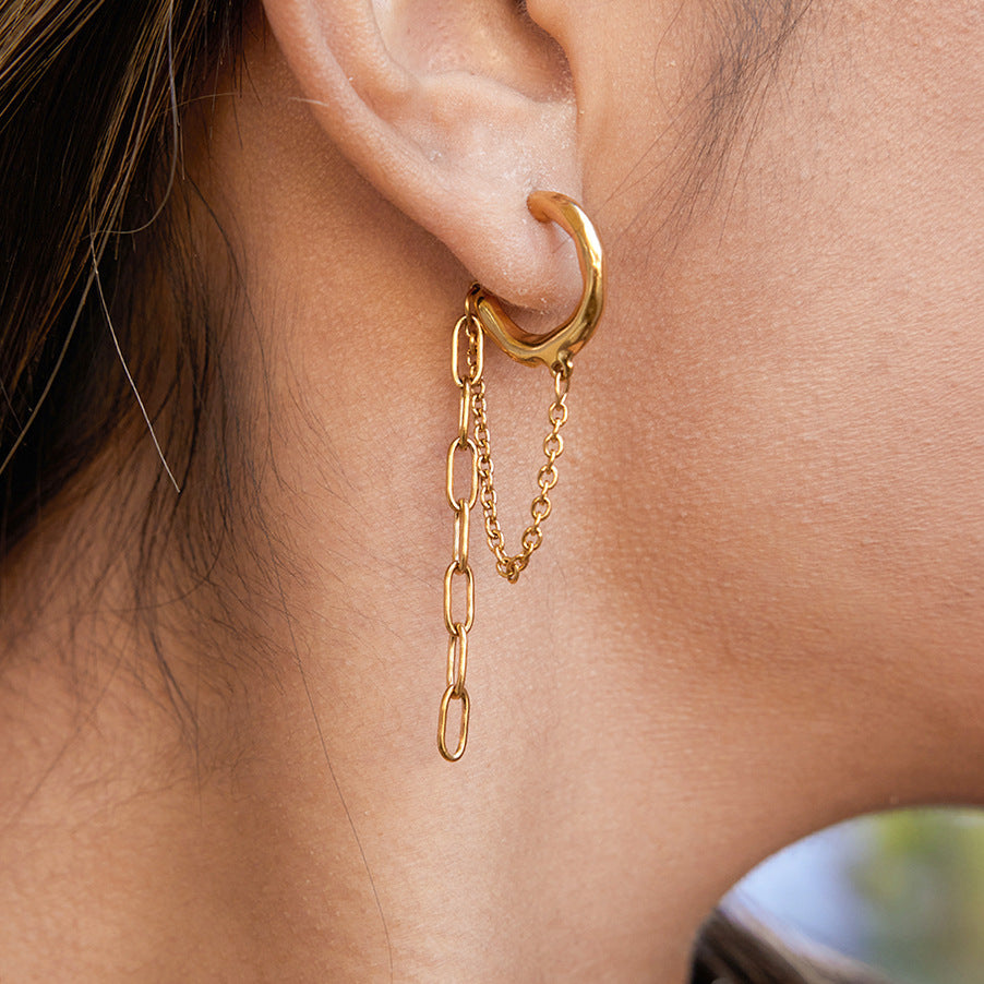 gold plated stainless steel hoop earring with asymmetric chain drops worn on ear