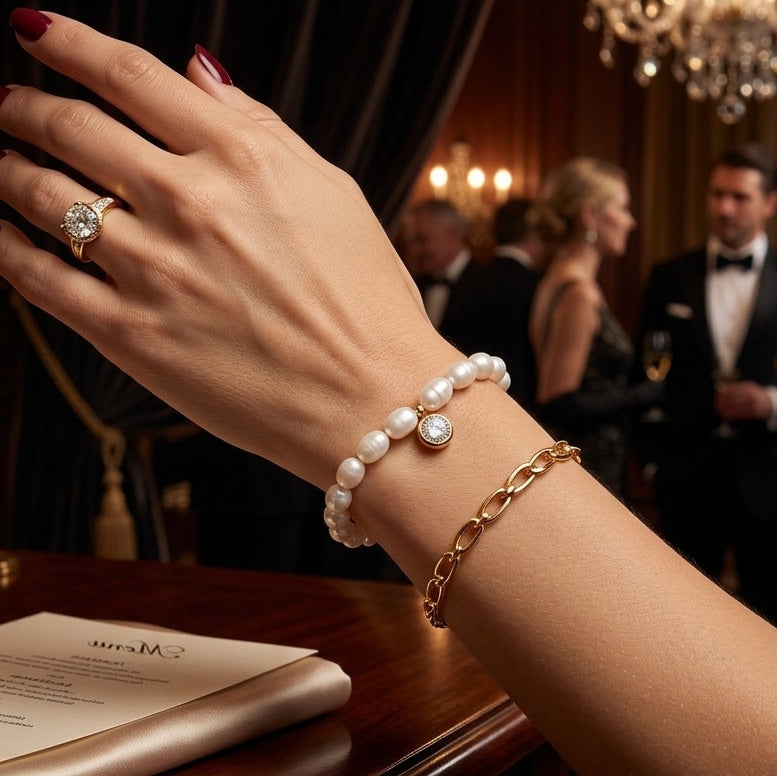 Pearl-look bead bracelet styled with gold tone chain bracelets