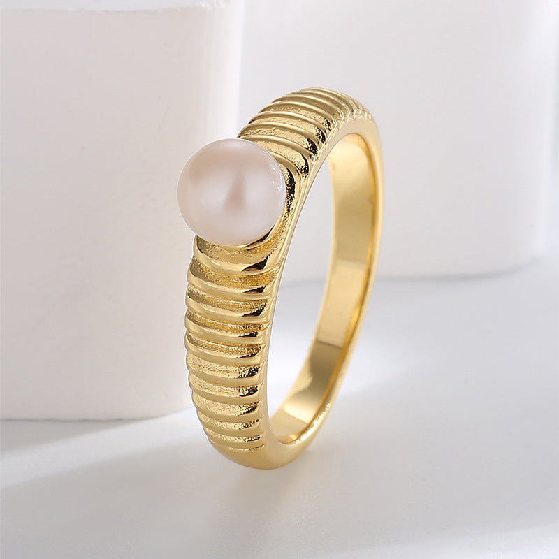 angled view of vintage ribbed shell pearl cocktail ring