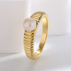 angled view of vintage ribbed shell pearl cocktail ring
