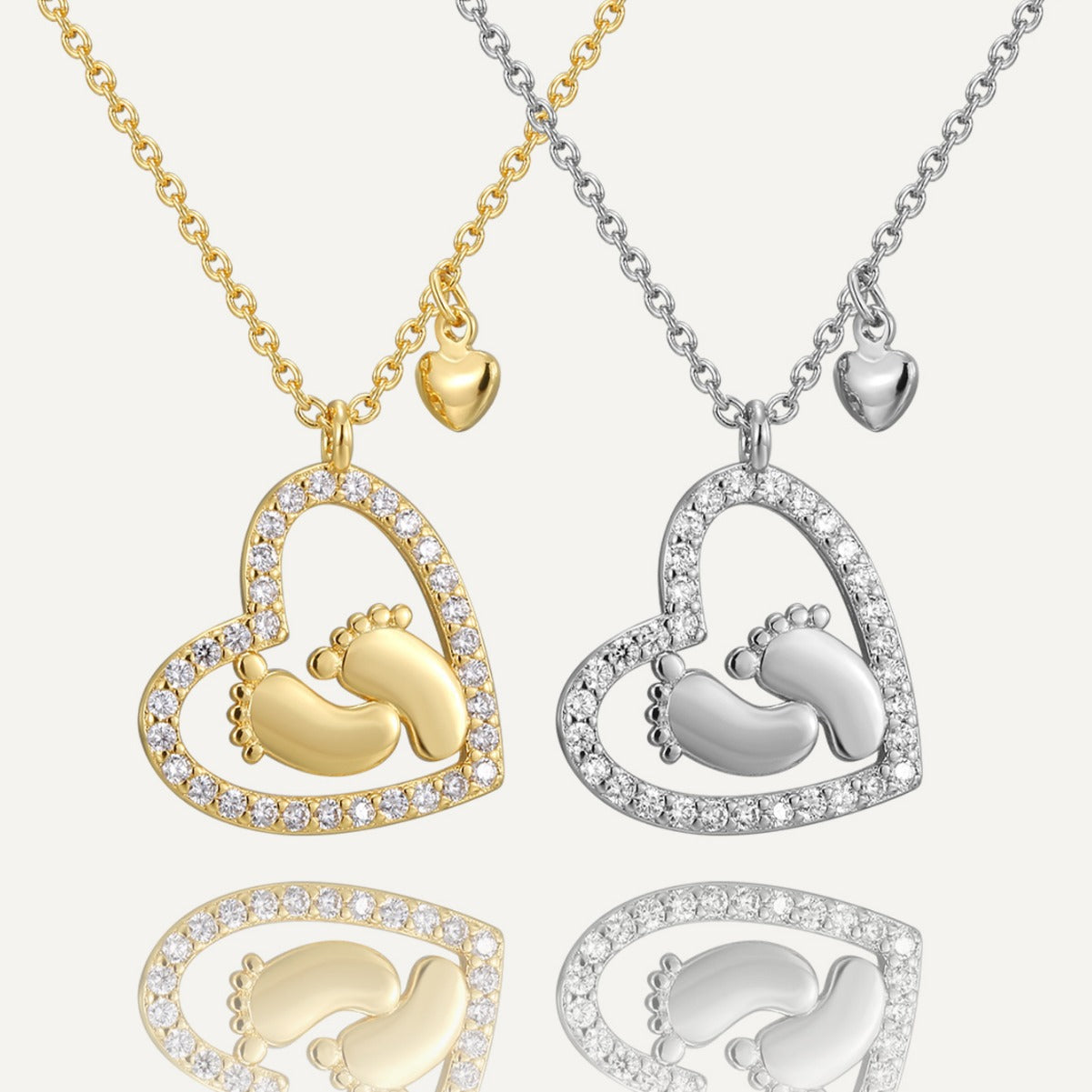 gold plated and silver-finish brass baby footprint heart necklaces