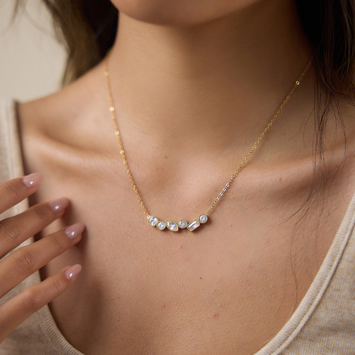 Single clear stone cluster necklace at neckline