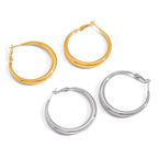 two sizes of graduated stainless steel hoops in gold plated and silver finish