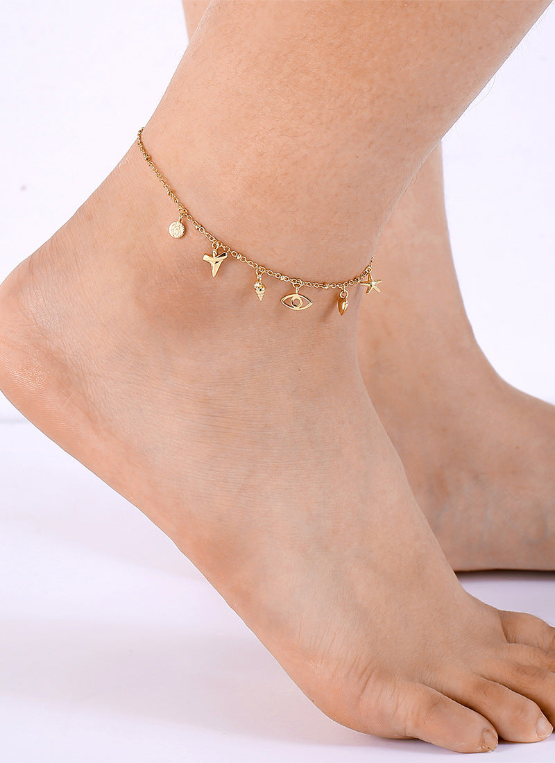 front ankle view of gold plated eclectic coastal charms