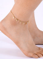 front ankle view of gold plated eclectic coastal charms