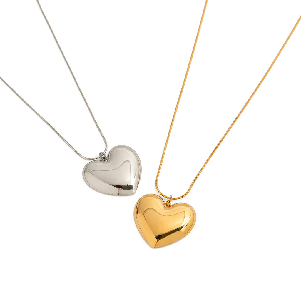 Two heart necklace colors shown for styling comparison