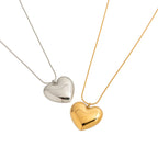 Two heart necklace colors shown for styling comparison