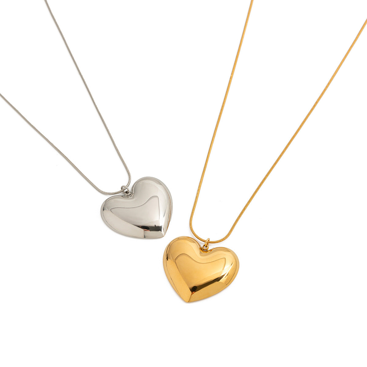 Two heart necklace colors shown for styling comparison