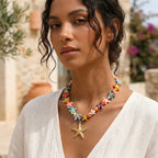 Multicolored starfish bead necklace worn with a white top