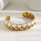gold plated stainless steel cuff with white imitation-pearl hearts