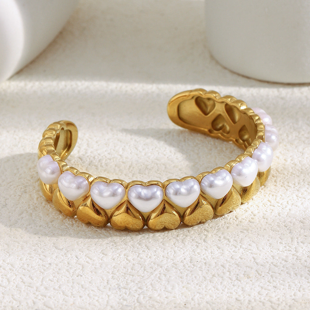 gold plated stainless steel cuff with white imitation-pearl hearts