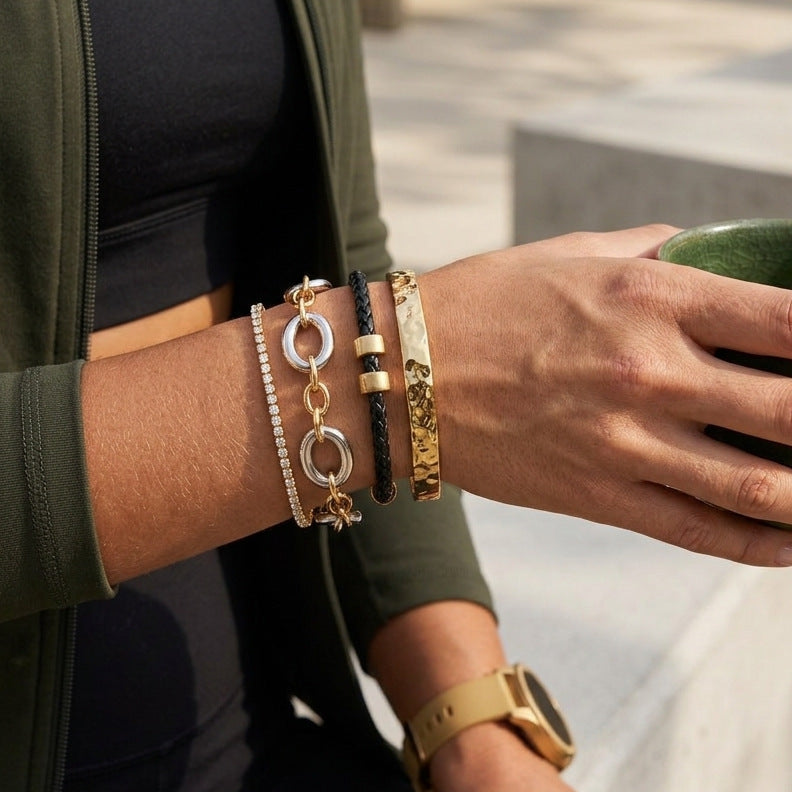 Two-tone oval link bracelet worn in a stack