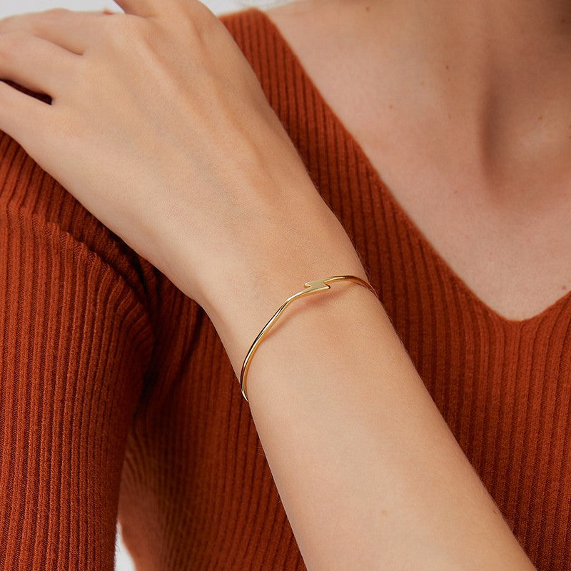 close wrist view of integrated lightning motif open bracelet