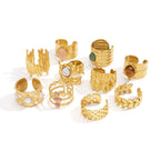 Ten gold-tone statement ring designs displayed together