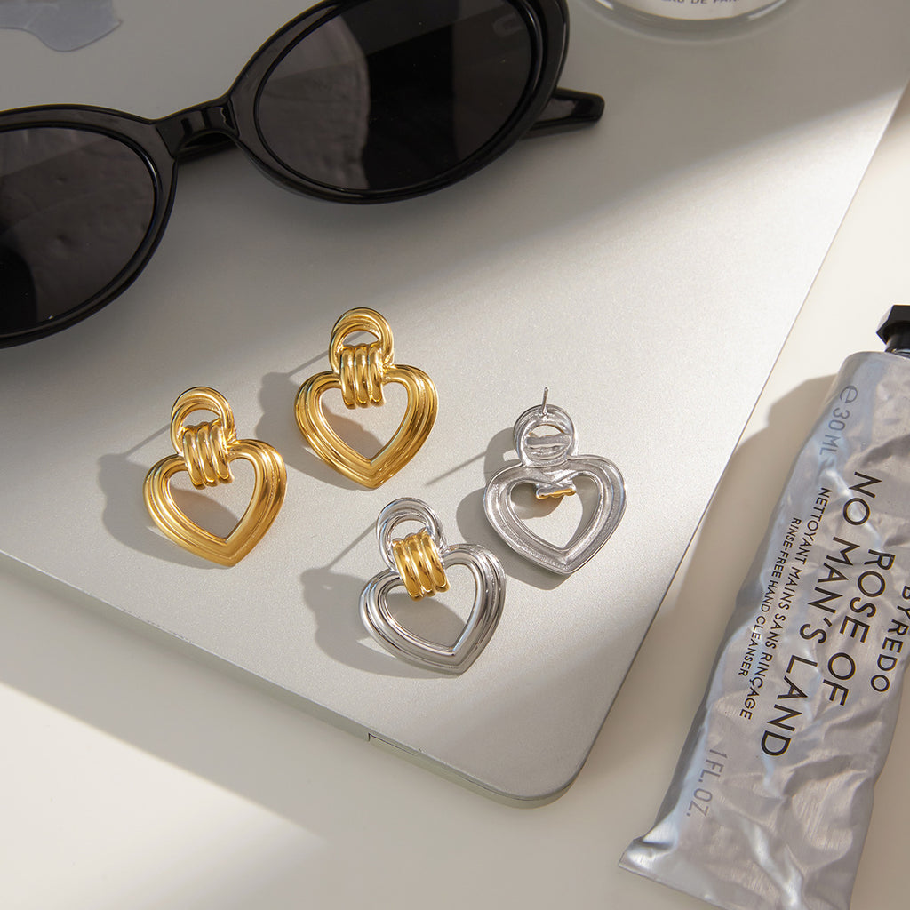 Two-Tone Open Heart Stainless Steel Drop Earrings — front view of the silver outer-heart option