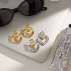 Two-Tone Open Heart Stainless Steel Drop Earrings — front view of the silver outer-heart option
