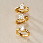 Square round and pear solitaire rings arranged vertically