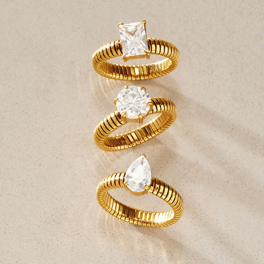 Square round and pear solitaire rings arranged vertically