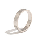 Silver tone band showing fine shell and sea-life outlines