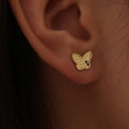 gold plated 925 silver butterfly stud worn on the earlobe