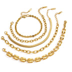 Gold tone bracelet assortment on white