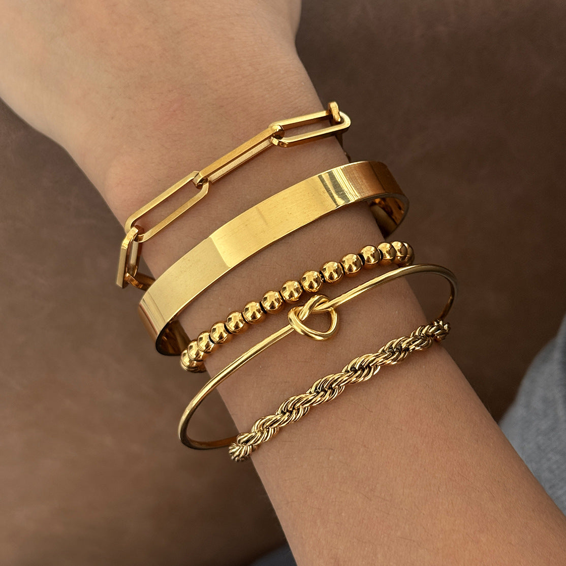 Rope bead and elongated-link bracelets with open cuffs