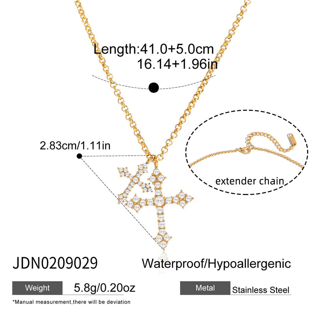 Paired clear-accent crosses on a gold-tone chain
