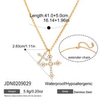 Paired clear-accent crosses on a gold-tone chain