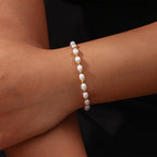 delicate freshwater pearl slider bracelet worn on the wrist