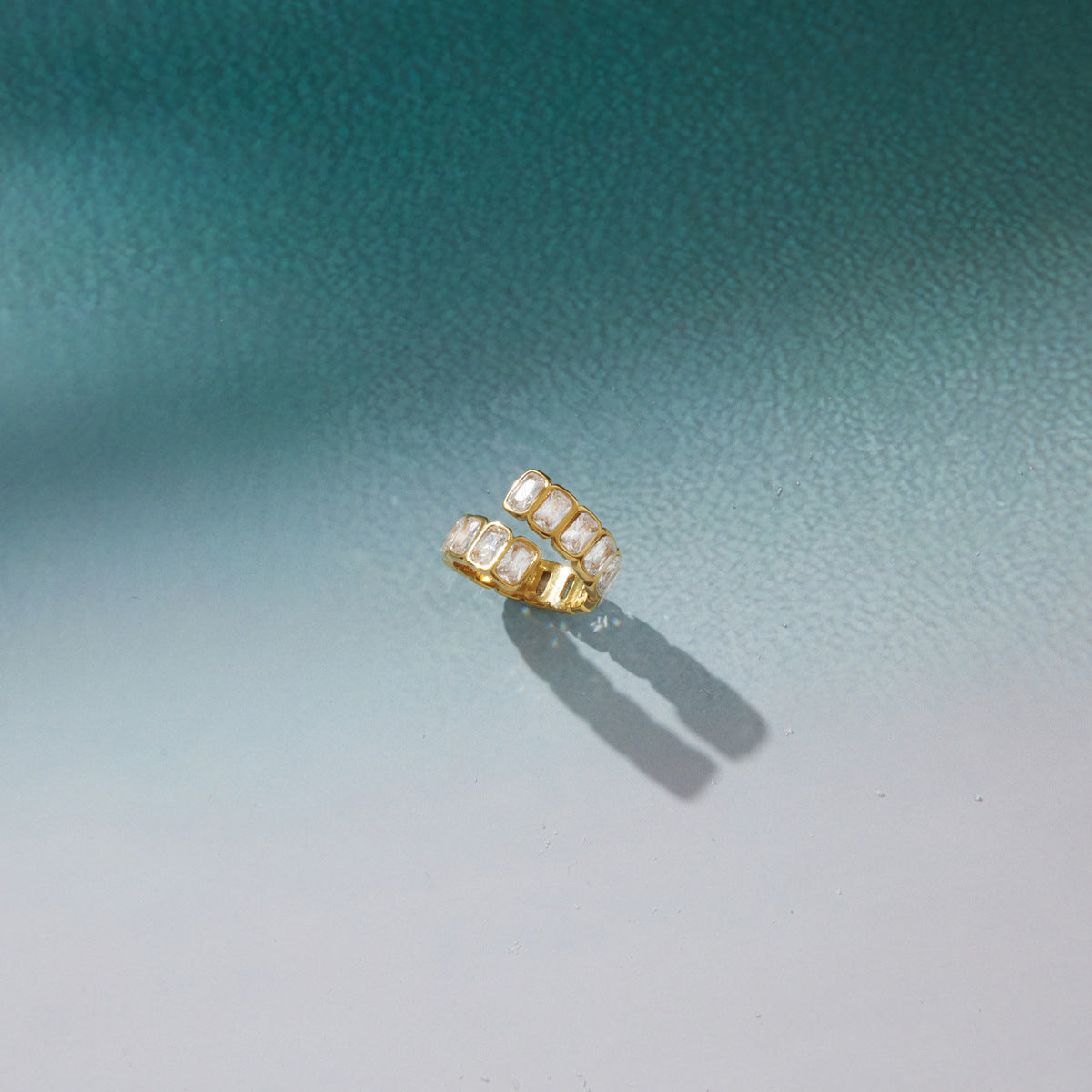 Bypass ring casting a shadow on a green surface