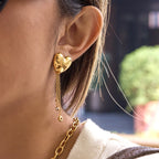 gold plated stainless steel heart chain drop earrings worn from the side