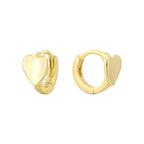 isolated front and profile cutout of gold plated heart huggies