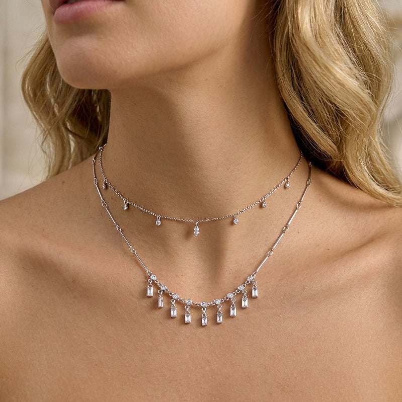 Silver tone rectangular stone fringe necklace layered with a separate chain