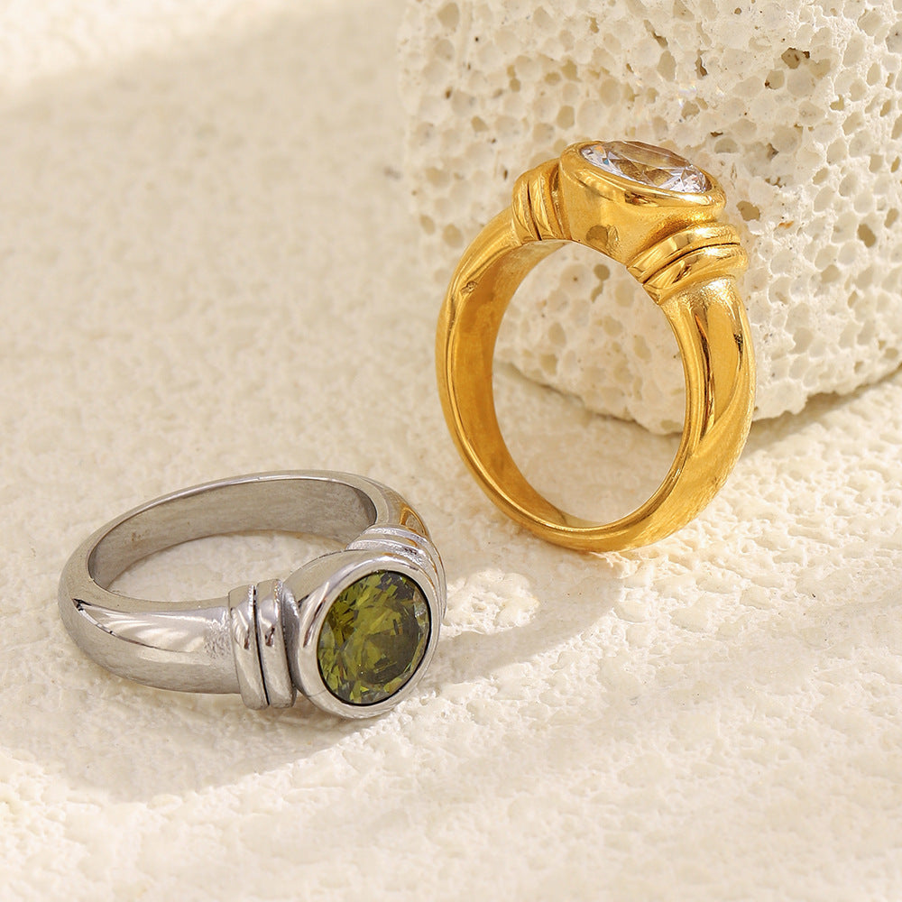 gold plated clear-stone and silver-finish green-stone cocktail rings