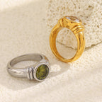 gold plated clear-stone and silver-finish green-stone cocktail rings