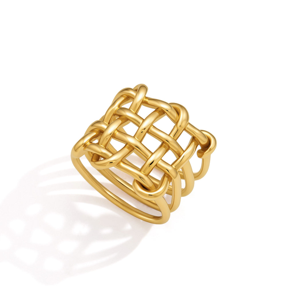 Gold tone ring showing interlaced rounded bars