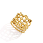 Gold tone ring showing interlaced rounded bars