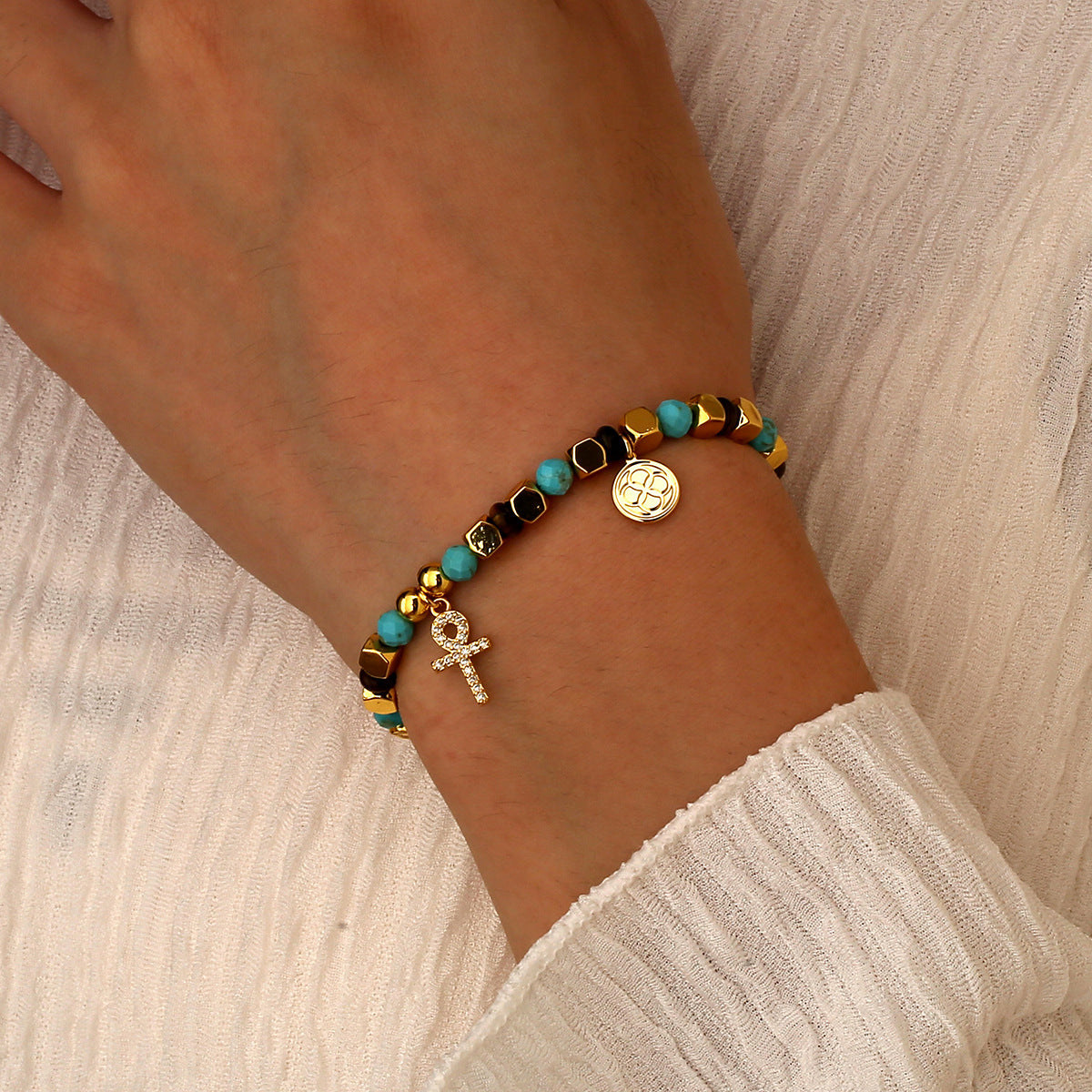 model wearing the gold plated cross charm bead bracelet