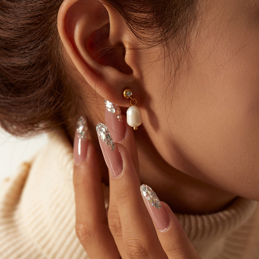 freshwater pearl and clear accent drop earring worn on the ear
