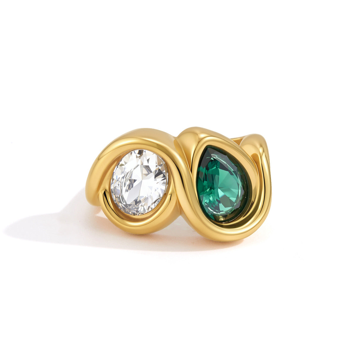 Green pear and clear oval settings on white background