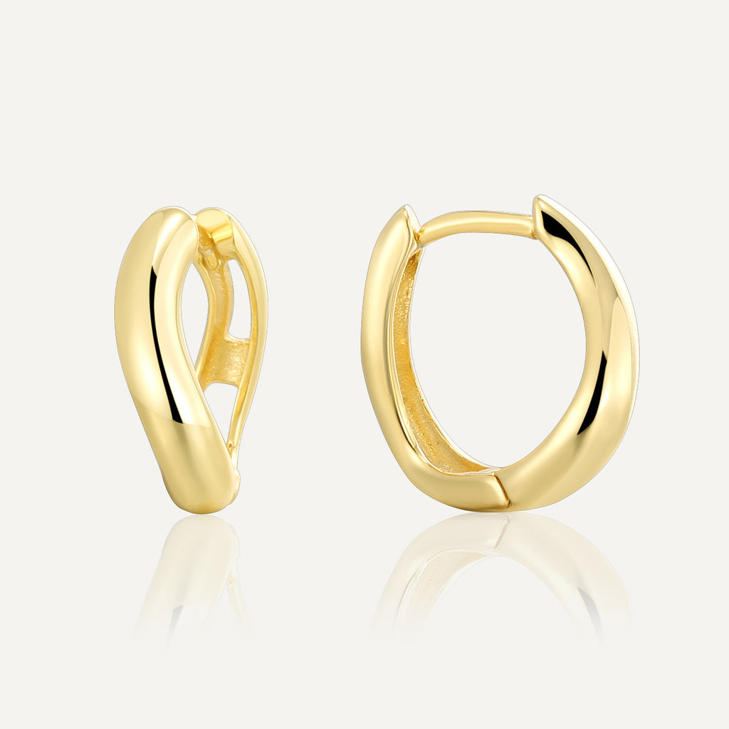 gold plated 925 silver sculptural open huggie earrings on white