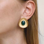 green resin cabochon gold plated statement stud earring worn on ear