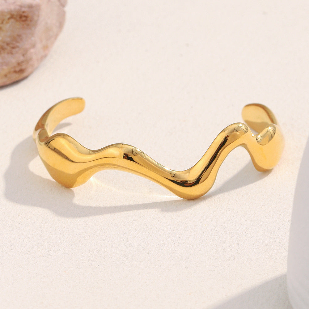 gold plated stainless steel sculptural wave open cuff bracelet