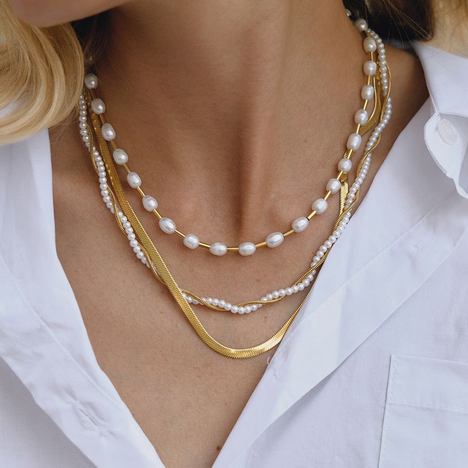 Gold-Tone Layered Stainless Steel Necklace and Huggie Earring Collection styled product view