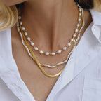 Gold-Tone Layered Stainless Steel Necklace and Huggie Earring Collection styled product view